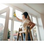 A woman cleaning a window