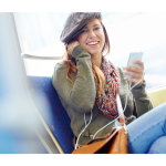 Woman on a train ride smiling at the camera.